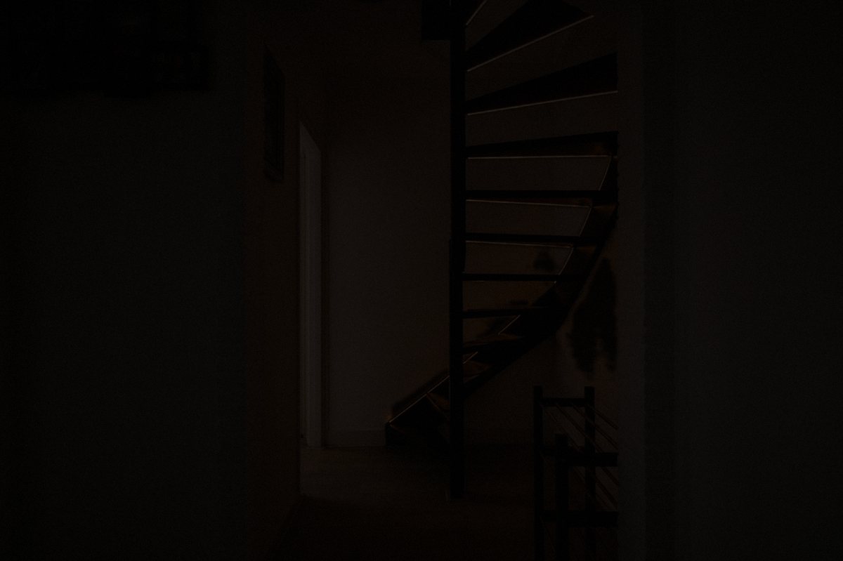 The spiral staircase lighting up one tread at a time